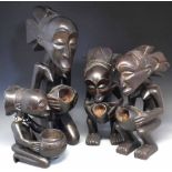 Four Luba -Hemba kneeling female bowl bearers, (4) the tallest measures 65cm high    All lots in