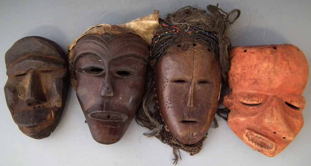 Four African masks including a Pende sickness mask, (4) the largest measures 28cm high       All