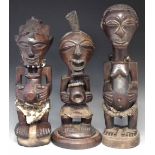 Three Zairian figures, the tallest figure measures 49cm overall height.     All lots in this