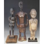 Lobi standing figure, a mother and child group and a Senufo female standing figure, (3) the