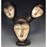 Lega four mask figure, with one mask carved to the reverse. 38cm high     All lots in this Tribal