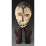 Lega mask / two legged figure, 37cm high     All lots in this Tribal and African Art Sale are sold