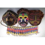 Four pieces of African beadwork, to include three masks and a cache, (4)     All lots in this Tribal