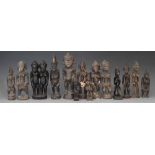 Thirteen small Senufo figures and a figure group, (14) the largest measures 23cm high    All lots in