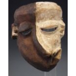 Pende Mbangu sickness mask, with fabric head dress, 25cm high     All lots in this Tribal and