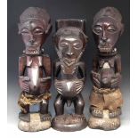 Three Zairian figures, the tallest figure measures 59cm overall height.     All lots in this