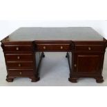 Reproduction Georgian mahogany partners' desk the skivered top over opposing drawers and doors,