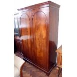 Reproduction mahogany Bradley hanging wardrobe with cross banded arched doors. Condition report: see