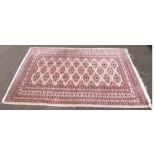 Modern Bokhare pattern rug. Condition report: see terms and conditions