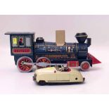 Schuco radio 4012 car also a Japanese TM tinplate train. Condition report: see terms and conditions