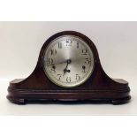 An oak cased Westminster chime mantel clock with pendulum and winding key. Condition report: see