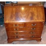 Reproduction mahogany Jaycee fall-front bureau with fitted interior on bracket feet. Condition