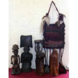 Five African figures, fly swatter and camel bag. Condition report: see terms and conditions