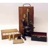 Microscope by E. Leitz with accessories and a box of glass slides. Condition report: see terms and