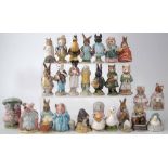 Twenty six Beswick Beatrix Potter figures, all with brown printed marks, to include: Amiable