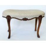 Victorian walnut kidney shaped dressing table stool, on French cabriole legs, length 86cm..