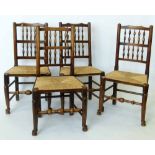 Four similar spindle-back dining chairs with rush seats.