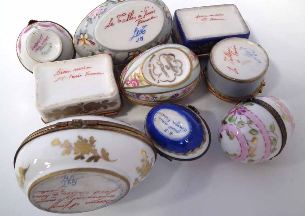Nine Limoges porcelain boxes, including five egg shaped boxes, painted with floral patterns and - Image 3 of 4