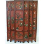 Japanese red lacquered six panel screen applied with decoration of figures, height 182 x 40cm.