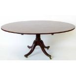 George III mahogany breakfast table with one piece oval top on turned column and four