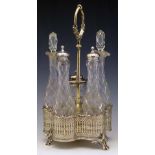 Victorian electro-plated cruet of five facetted bottles in a foliate stand, height 30cm.