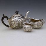 Silver embossed bachelor's three piece tea set, Birmingham 1894, gross weight 14oz 9dwt (3).