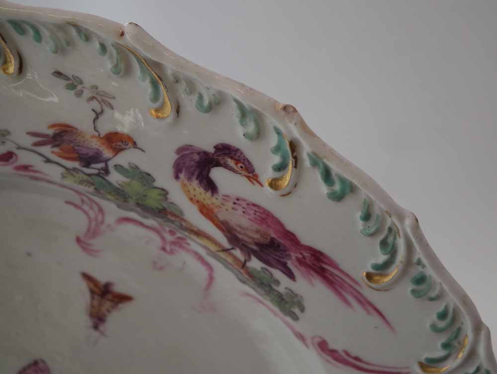 Two Chelsea plates circa 1760, painted with exotic birds within a feather and floral moulded border, - Image 6 of 9