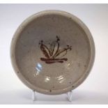 St Ives studio pottery small bowl attributed to Bernard Leach, painted with a flower head motif,