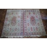 Pair of Kerman garden carpets, each carpet measures 284cm x 177cm