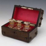 Gothic Revival rosewood box containing three gilded glass scent bottles, box width 16cm.