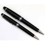 Montblanc black resin Pix ballpoint pen and the matching lady's pen, numbered CR1611257 and