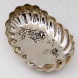 Continental fluted oval bowl embossed with a spray of flowers, indistictly marked on lip, length