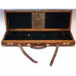 Westley Richards shotgun case, of oak and leather construction with brass fittings, trade label to