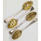 Two pairs of Georgian silver gilt berry spoons, 21.5cm, 7oz 8dwt all in.