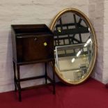 Oval mirror with gold painted frame and a 1930's oak stationary stand. Condition report: see terms