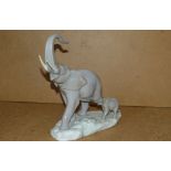 A Lladro Group of an elephant and its yo