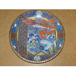 An Oriental Round Dish on multicoloured