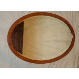 An Edwardian Mahogany Oval Hanging Bevelled Wall Mirror with inlaid boxing and stringing, 89.5cm