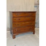 A George III Mahogany Straight Front Chest of Drawers having 4 long graduated drawers with drop