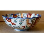 An Imari Round Scalloped Bowl on white, red, blue and green ground having floral and leaf