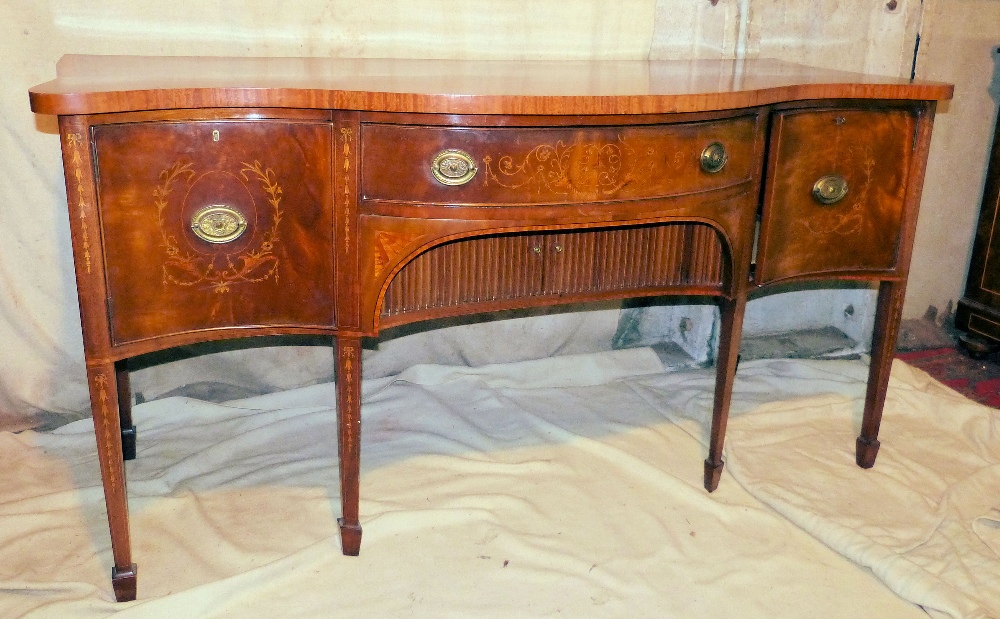 A 19th Century Mahogany Serpentine Fronted Sideboard having all over vase floral, shell, ribbon,