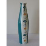 A Burleigh Ware Bulbous Thin Necked Vase on green and white ground having circle decoration, 28cm