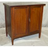 A Mahogany Low Cupboard having inlaid stringing, 2 panelled doors enclosing drawers and shelves on