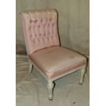 A Continental White Painted Nursing Chair having pink silk overstuffed seat and button back, on