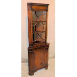 A Reproduction Mahogany Freestanding 2 Sectioned Corner Cupboard having astragal glazed door,