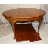 A Good Quality Mahogany Oval Key Wind Dining Table having 2 extra leaves on cabriole legs with claw