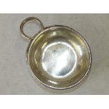 A Continental Silver Coloured Metal Tastevin having ring handle inscribed L Rigav 2.