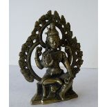 A Brass Figure of a seated goddess on half round base, 17.