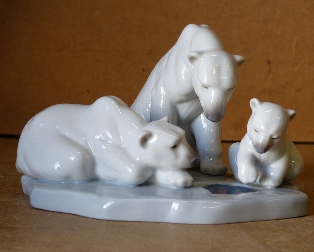 A Lladro Group of 3 Polar Bears on scalloped base,