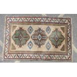 An Eastern Rug on beige ground having multicoloured decoration, 3 centre medallions,